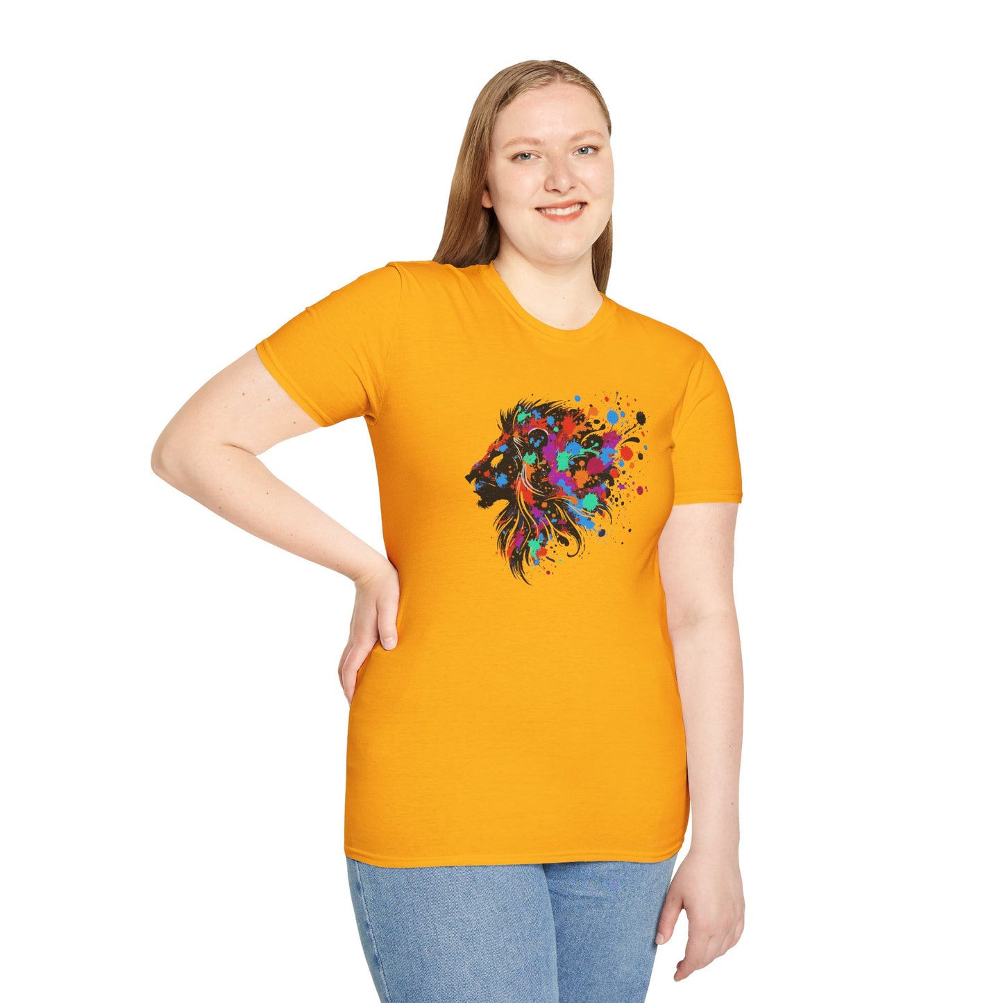 a woman wearing a gold colored tshirt background featuring a vibrant ink splatter forming the side profile of a lion's head, showcasing bold colors and dynamic artistic detail.