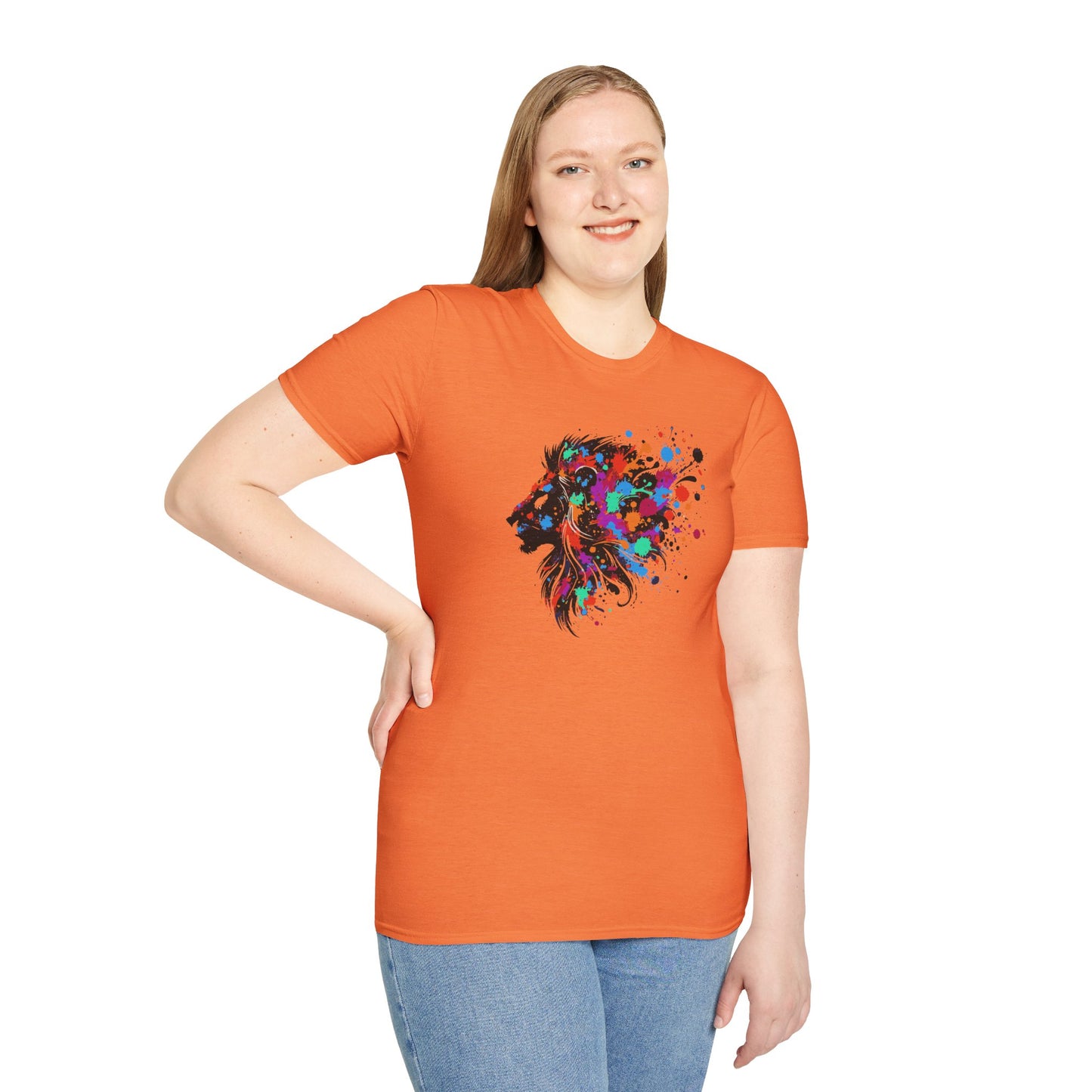 a woman wearing a heather orange colored tshirt background featuring a vibrant ink splatter forming the side profile of a lion's head, showcasing bold colors and dynamic artistic detail.