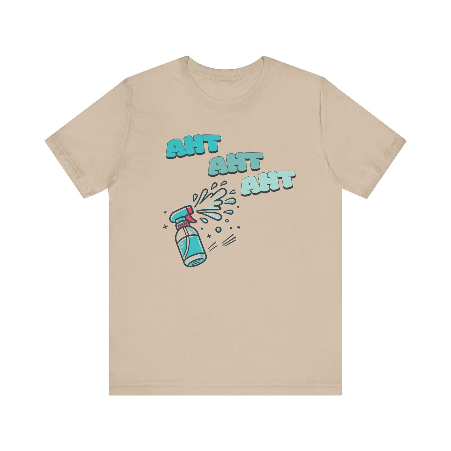 A spray bottle shooting three squirts of water, each squirt accompanied by the playful text 'Aht Aht Aht.' The design is printed on a tan T-shirt, adding a humorous and cheeky vibe, perfect for warding off unwanted behavior with a lighthearted message.