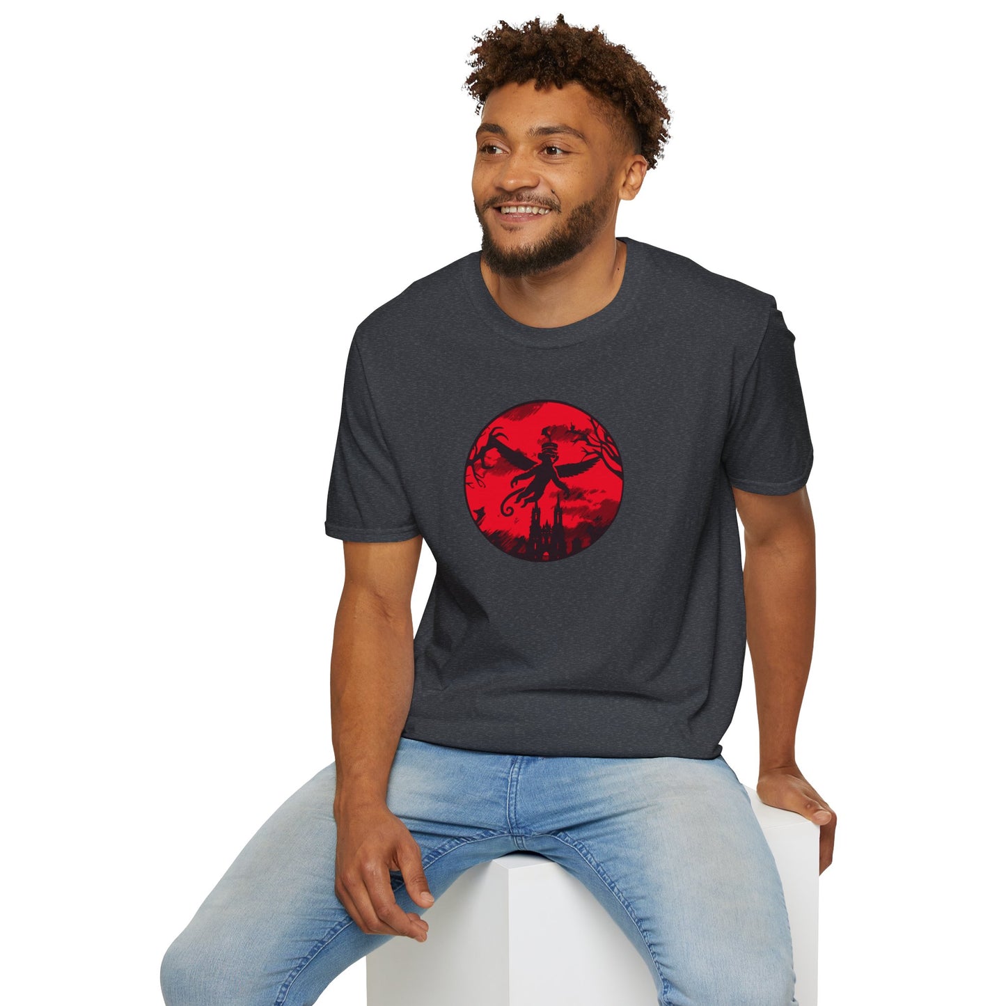 a man wearing a dark heather grey colored t-shirt featuring a winged monkey soaring against a haunting red sky, perfect for embracing your wild and mischievous side with bold, daring style