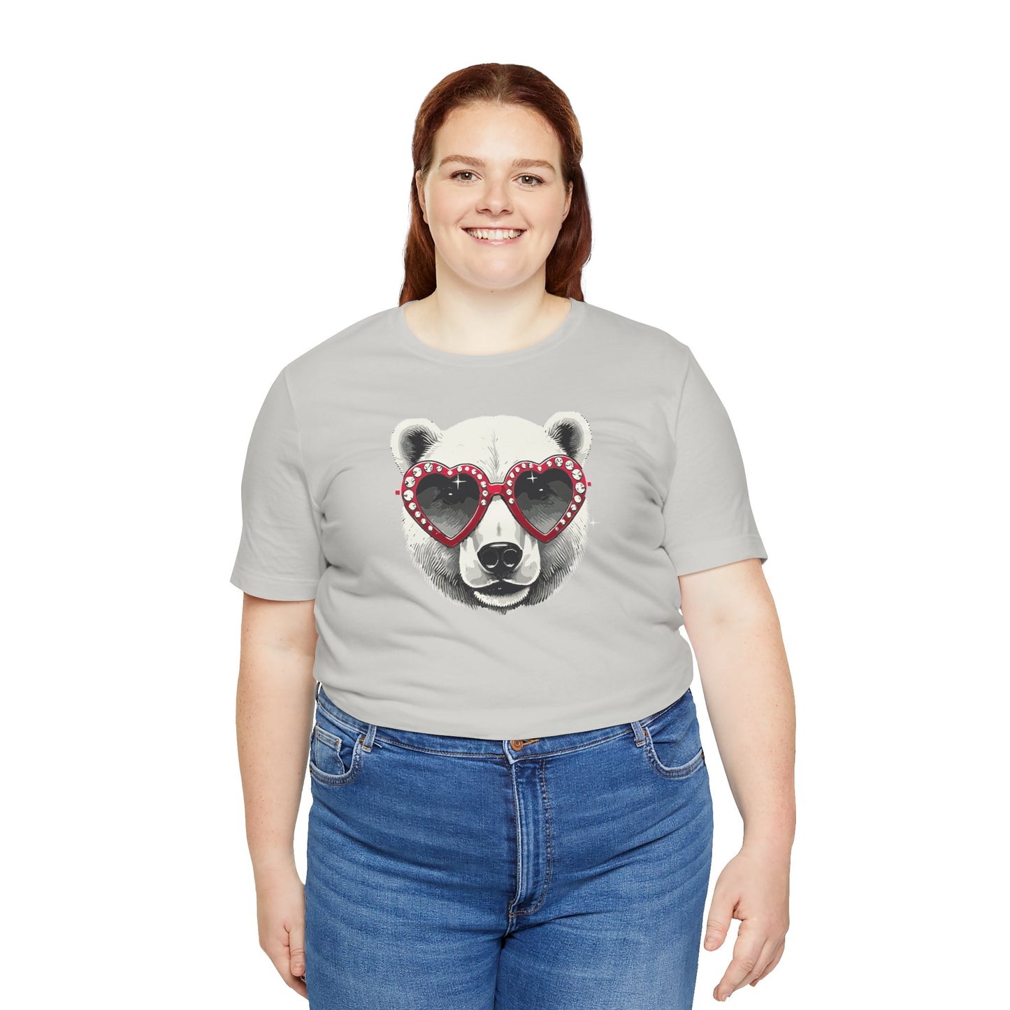a woman wearing a silver color t-shirt with a white polar bear face wearing a a heart-shaped sunglasses