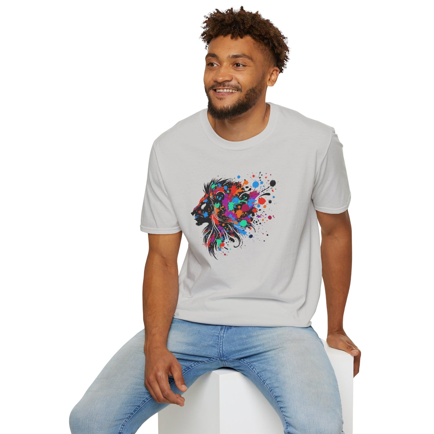 a man wearing an ice grey colored tshirt background featuring a vibrant ink splatter forming the side profile of a lion's head, showcasing bold colors and dynamic artistic detail.