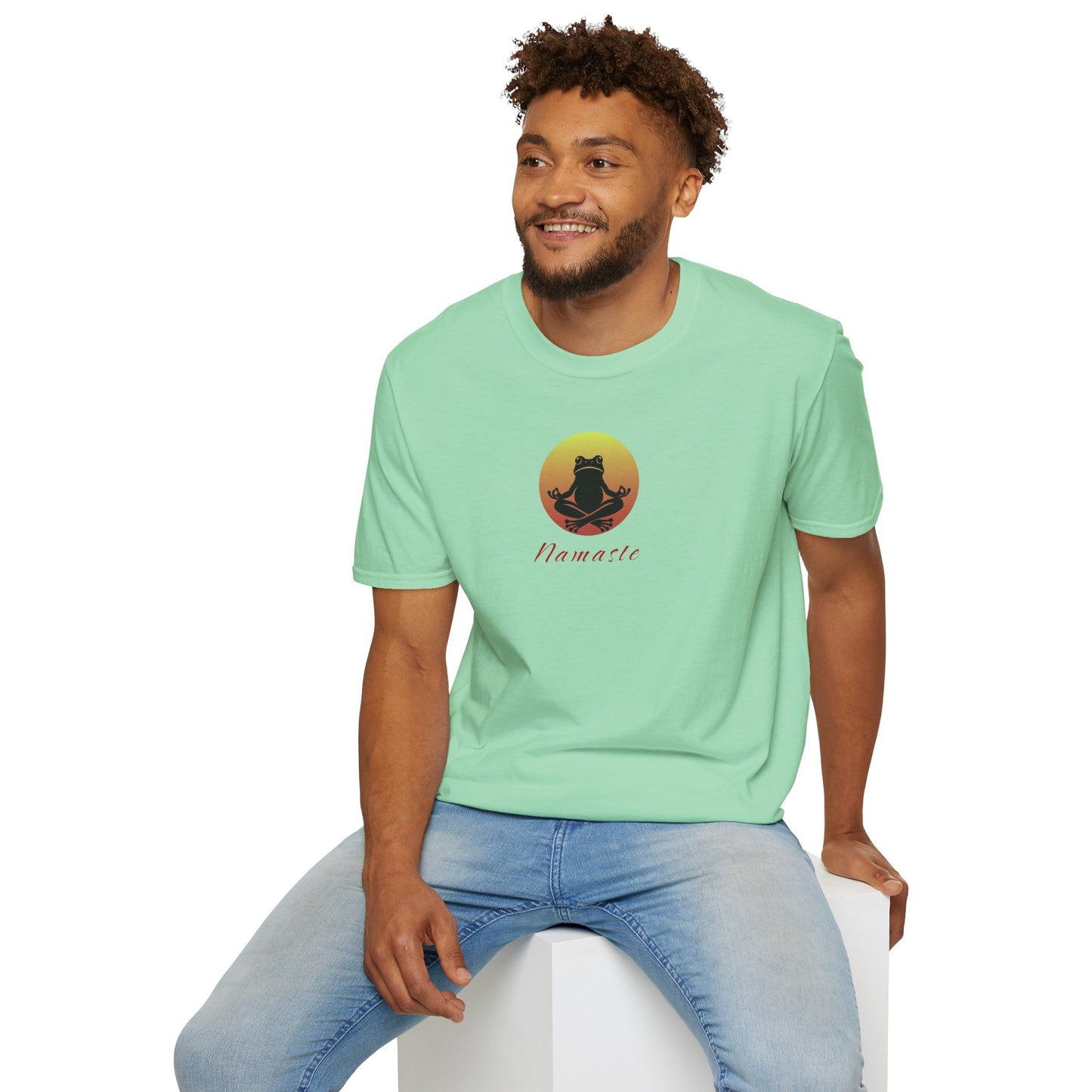 a man wearing a mint-colored T-shirt featuring a relaxed frog in a peaceful yoga pose, ideal for self-care enthusiasts and mindfulness lovers. This zen-inspired shirt offers comfort and calm for yoga practice or everyday wear.