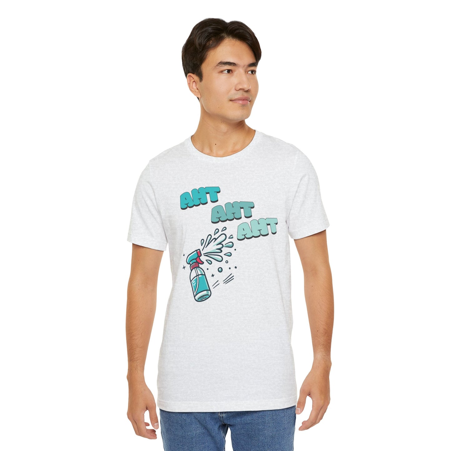 A spray bottle shooting three squirts of water, each squirt accompanied by the playful text 'Aht Aht Aht.' The design is printed on a ash T-shirt, adding a humorous and cheeky vibe, perfect for warding off unwanted behavior with a lighthearted message.