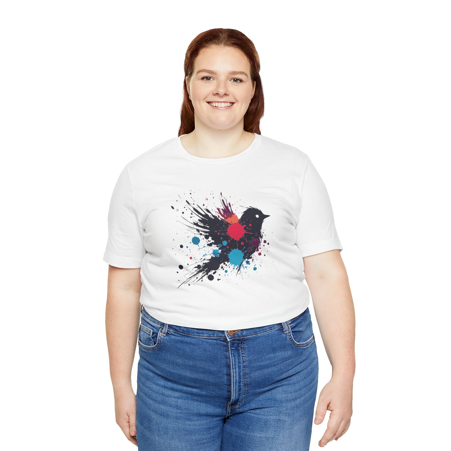 a woman wearing a white color t-shirt with an image of blue red and orange paint splatter bird