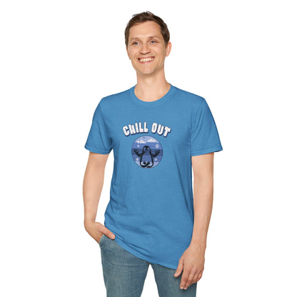 a man wearing a heather blue t-shirt featuring a relaxed penguin in a calm yoga pose, set against serene blue waters, snowy peaks, and gentle snowflakes. Perfect for promoting relaxation and cozy, laid-back vibes.