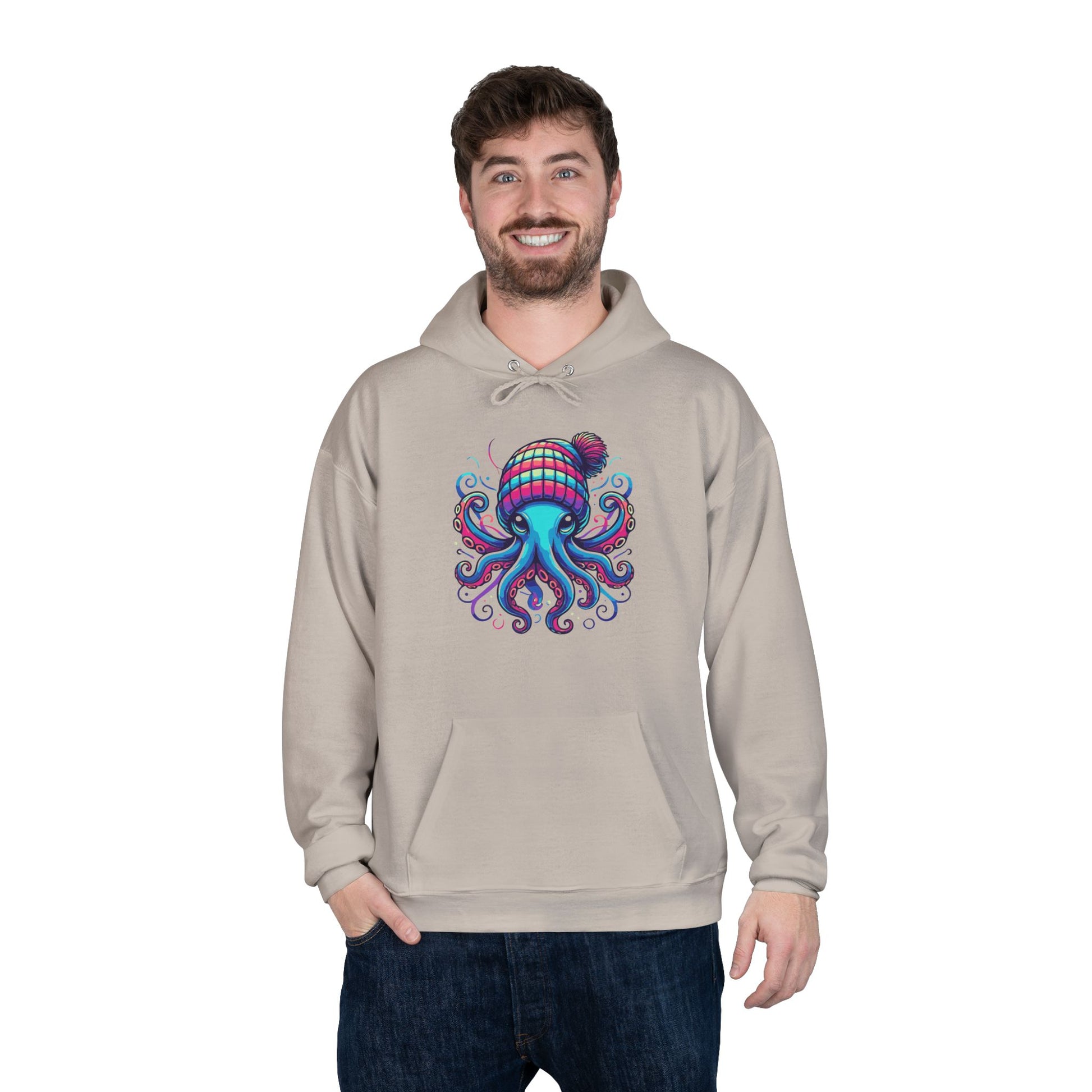 a man wearing a sand colored hoodie with an image of jewel-toned octopus wearing a knit cap