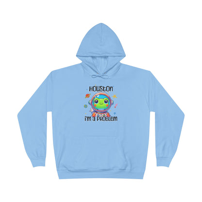 a light blue colored hoodie with graphic of a cute astronaut frog in a spacesuit, ready for an interstellar adventure. The design showcases the frog as a space cadet, radiating charm and joy, perfect for spreading smiles across the galaxy