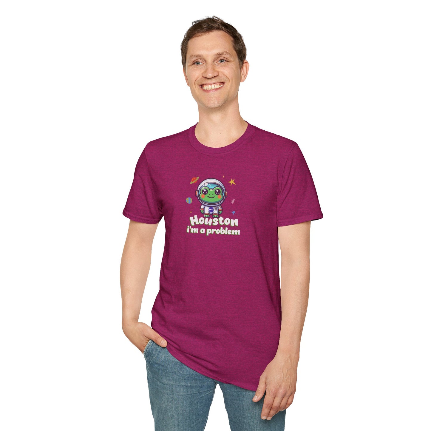 a man wearing a antique heliconia colored t-shirt with graphic of a cute astronaut frog in a spacesuit, ready for an interstellar adventure. The design showcases the frog as a space cadet, radiating charm and joy, perfect for spreading smiles across the galaxy