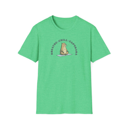 a heather irish green t-shirt with a capybara in a yoga pose sitting on a yoga mat with the text 'breathe, chill, capybara'.