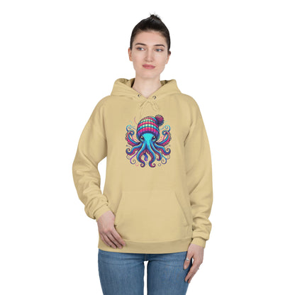 a woman wearing an athletic gold colored hoodie with an image of jewel-toned octopus wearing a knit cap