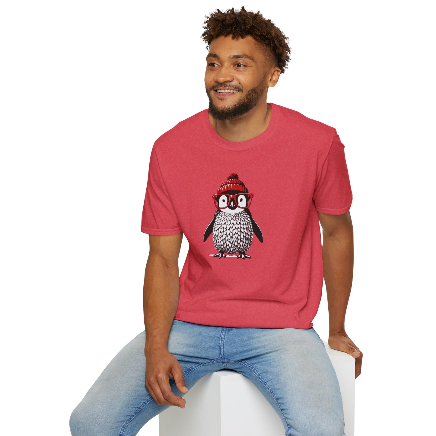 a man wearing a heather red colored t-shirt with an image of a penguin wearing a red beanie and red eyeglasses