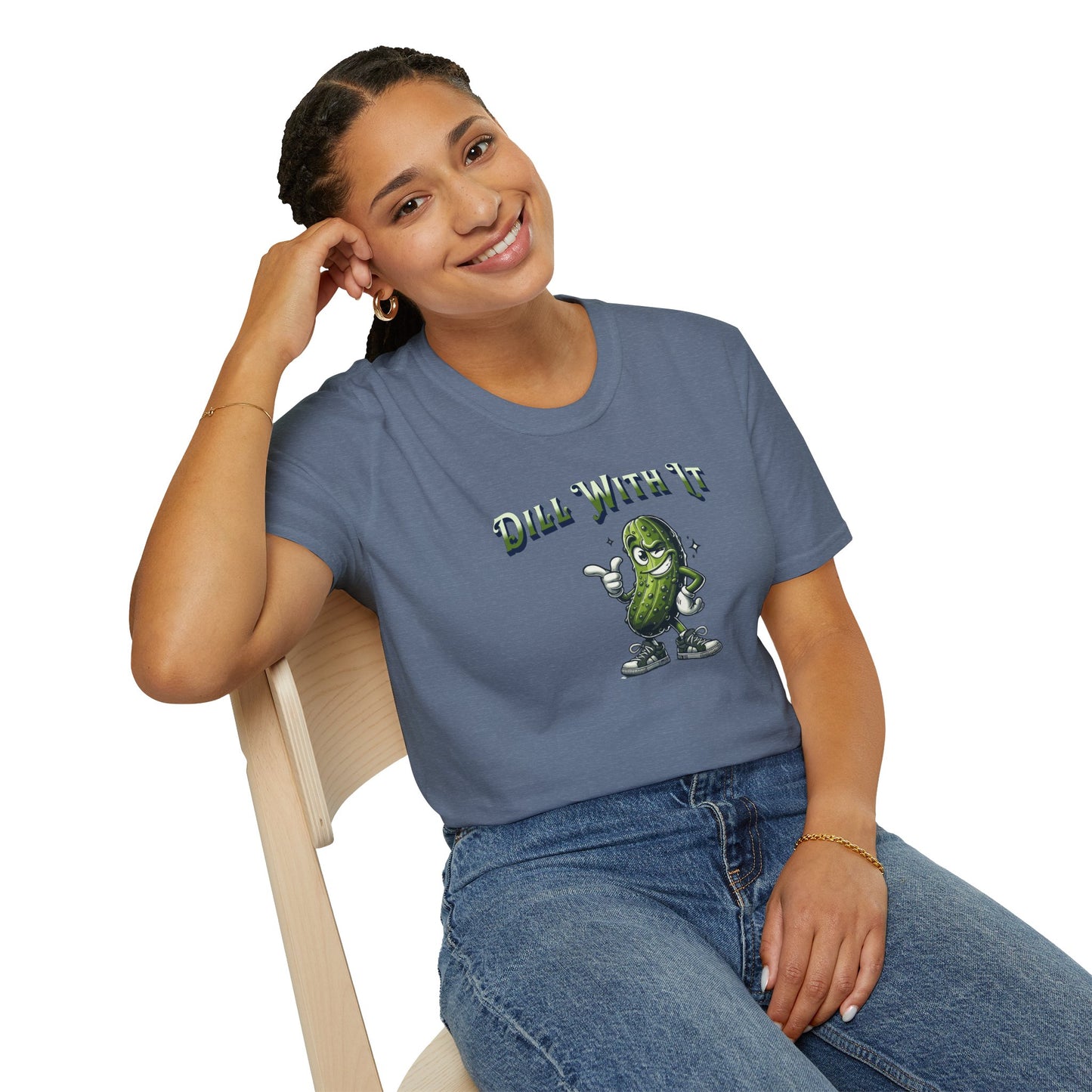 a woman wearing a heather indigo colored t-shirt featuring a snarky pickle with a smirking expression, accompanied by the text 'Dill with it.' The pickle exudes cool confidence, perfect for those who embrace their individuality and unbothered attitude.