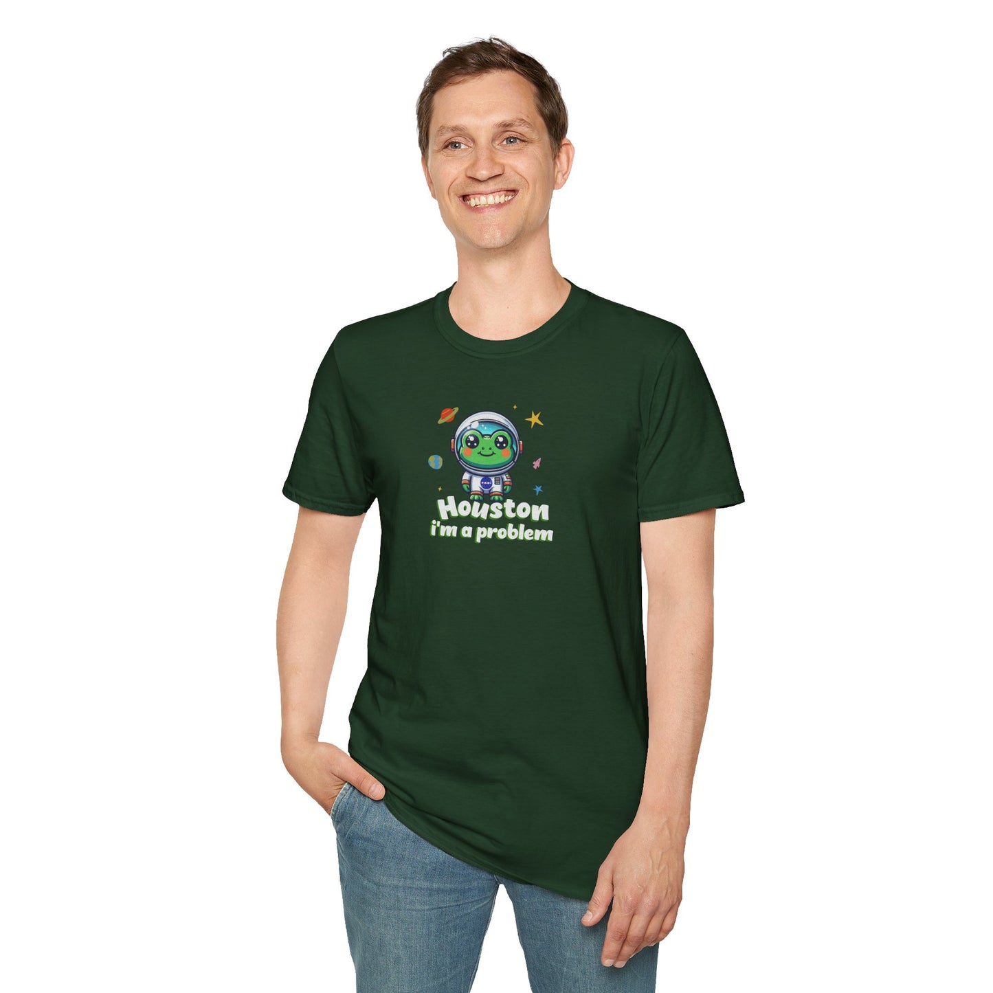 a man wearing a forest green colored t-shirt with graphic of a cute astronaut frog in a spacesuit, ready for an interstellar adventure. The design showcases the frog as a space cadet, radiating charm and joy, perfect for spreading smiles across the galaxy