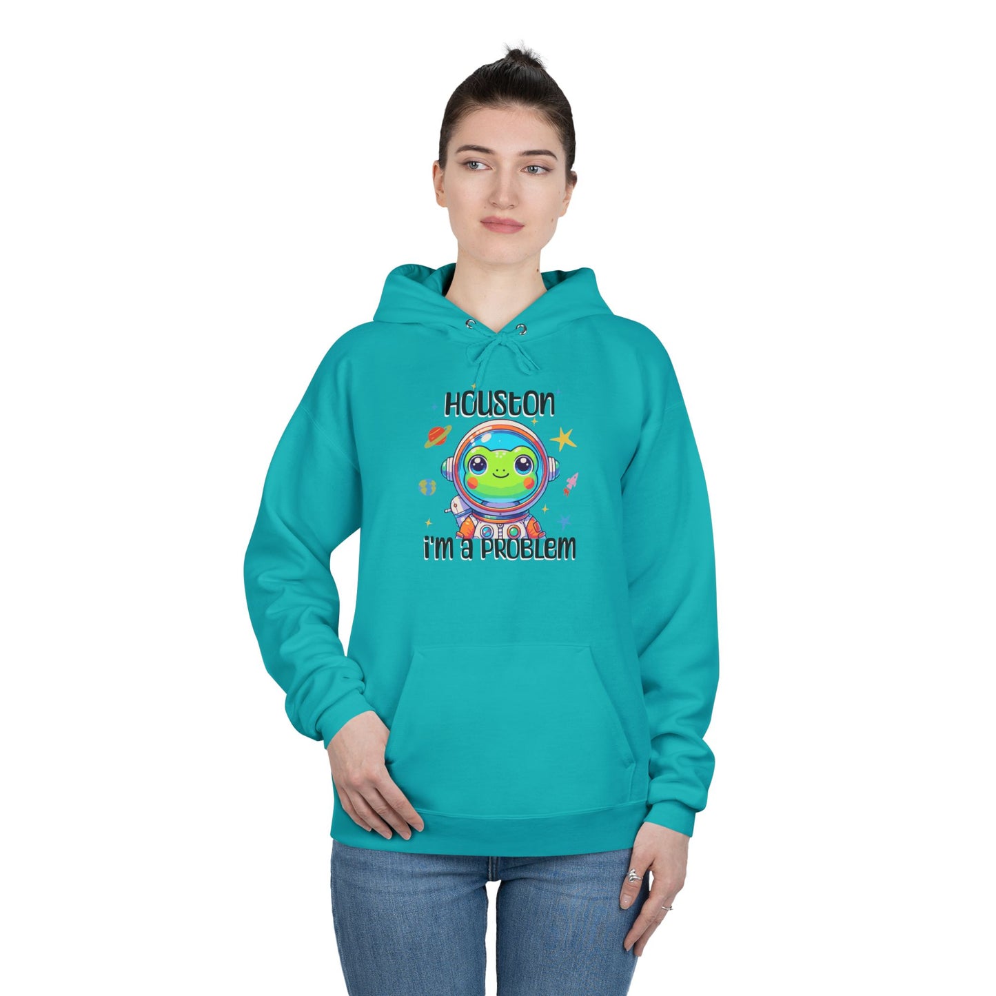 a woman wearing athletic teal colored hoodie with graphic of a cute astronaut frog in a spacesuit, ready for an interstellar adventure. The design showcases the frog as a space cadet, radiating charm and joy, perfect for spreading smiles across the galaxy