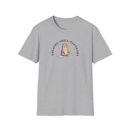 a sport grey colored t-shirt with a capybara in a yoga pose sitting on a yoga mat with the text 'breathe, chill, capybara'.