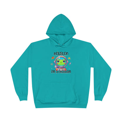 a athletic teal colored hoodie with graphic of a cute astronaut frog in a spacesuit, ready for an interstellar adventure. The design showcases the frog as a space cadet, radiating charm and joy, perfect for spreading smiles across the galaxy