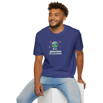 a man wearing a royal colored t-shirt with graphic of a cute astronaut frog in a spacesuit, ready for an interstellar adventure. The design showcases the frog as a space cadet, radiating charm and joy, perfect for spreading smiles across the galaxy