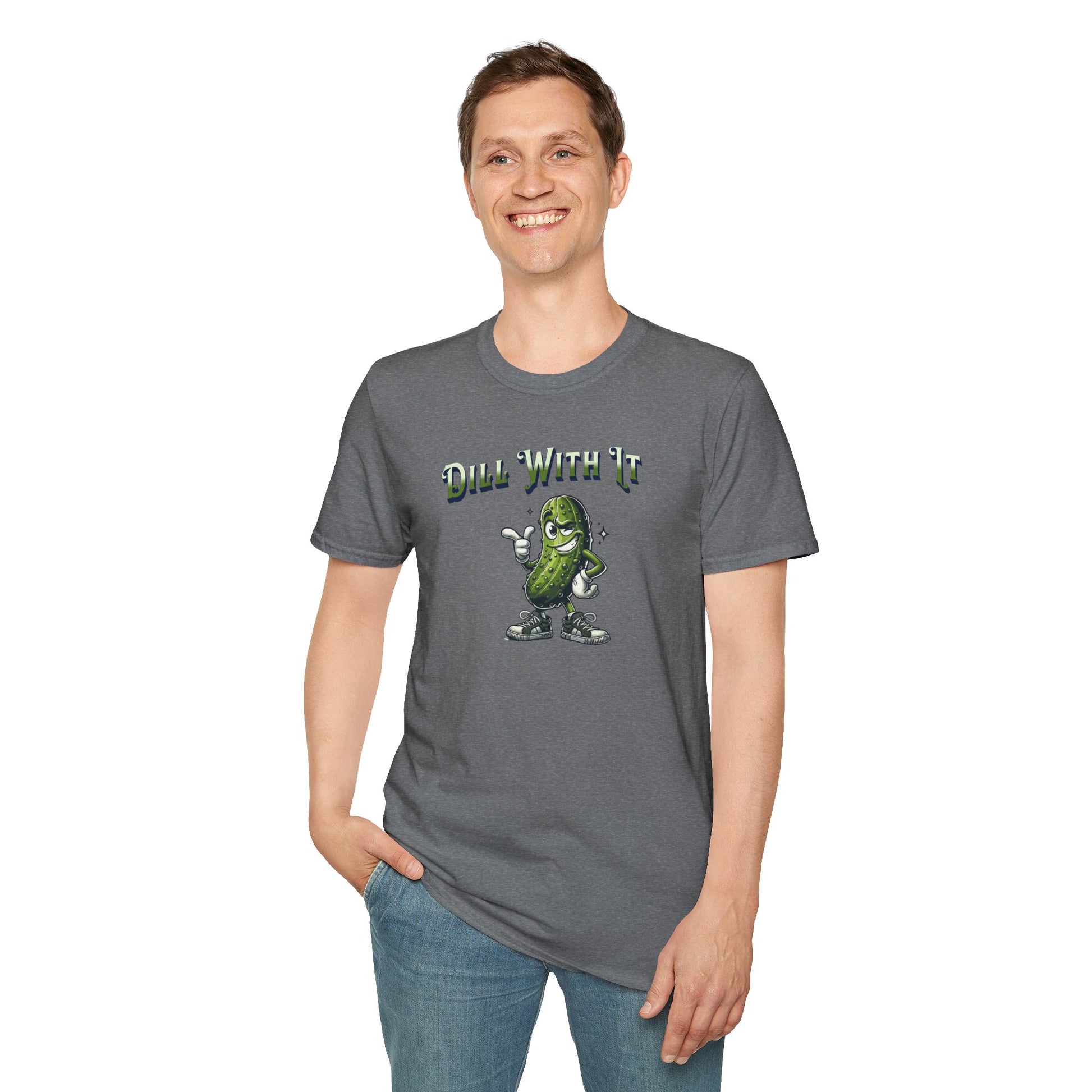 a man wearing a graphite heather colored t-shirt featuring a snarky pickle with a smirking expression, accompanied by the text 'Dill with it.' The pickle exudes cool confidence, perfect for those who embrace their individuality and unbothered attitude.