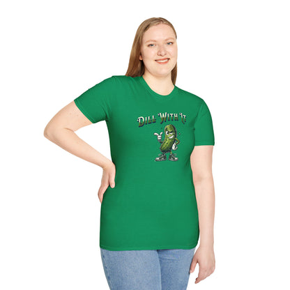 a woman wearing a Kelly green colored t-shirt featuring a snarky pickle with a smirking expression, accompanied by the text 'Dill with it.' The pickle exudes cool confidence, perfect for those who embrace their individuality and unbothered attitude.