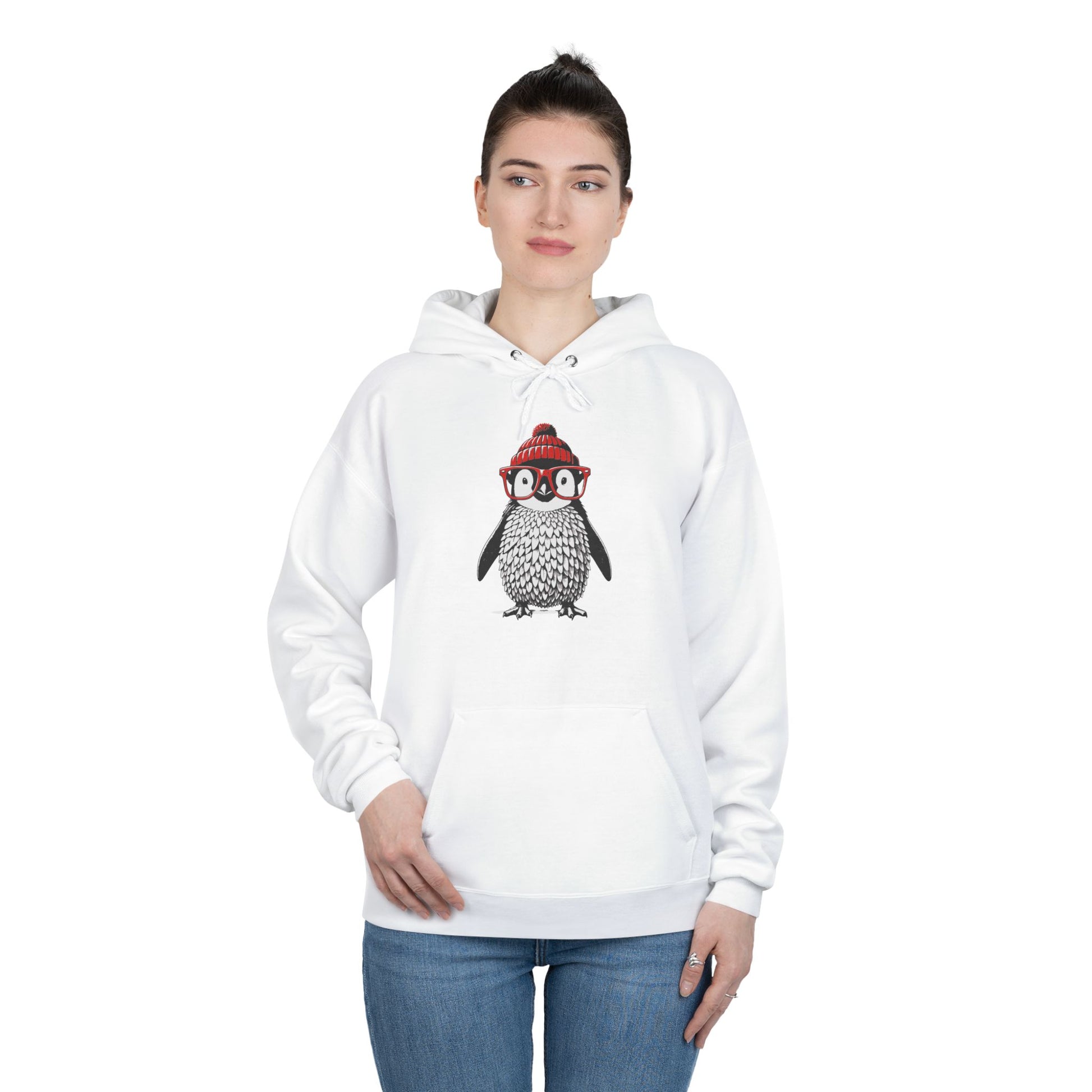 a woman wearing a white colored hoodie with an image of a penguin wearing a red beanie and red eyeglasses