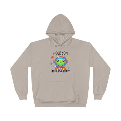 a sand colored hoodie with graphic of a cute astronaut frog in a spacesuit, ready for an interstellar adventure. The design showcases the frog as a space cadet, radiating charm and joy, perfect for spreading smiles across the galaxy