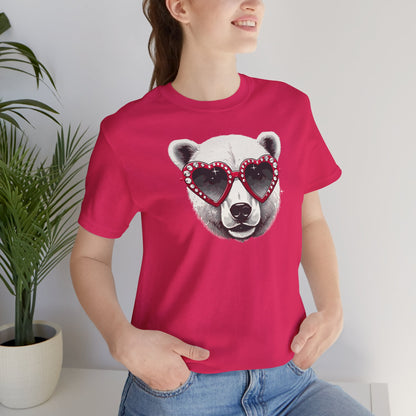 a woman wearing a fuchsia color t-shirt with a white polar bear face wearing a a heart-shaped sunglasses 