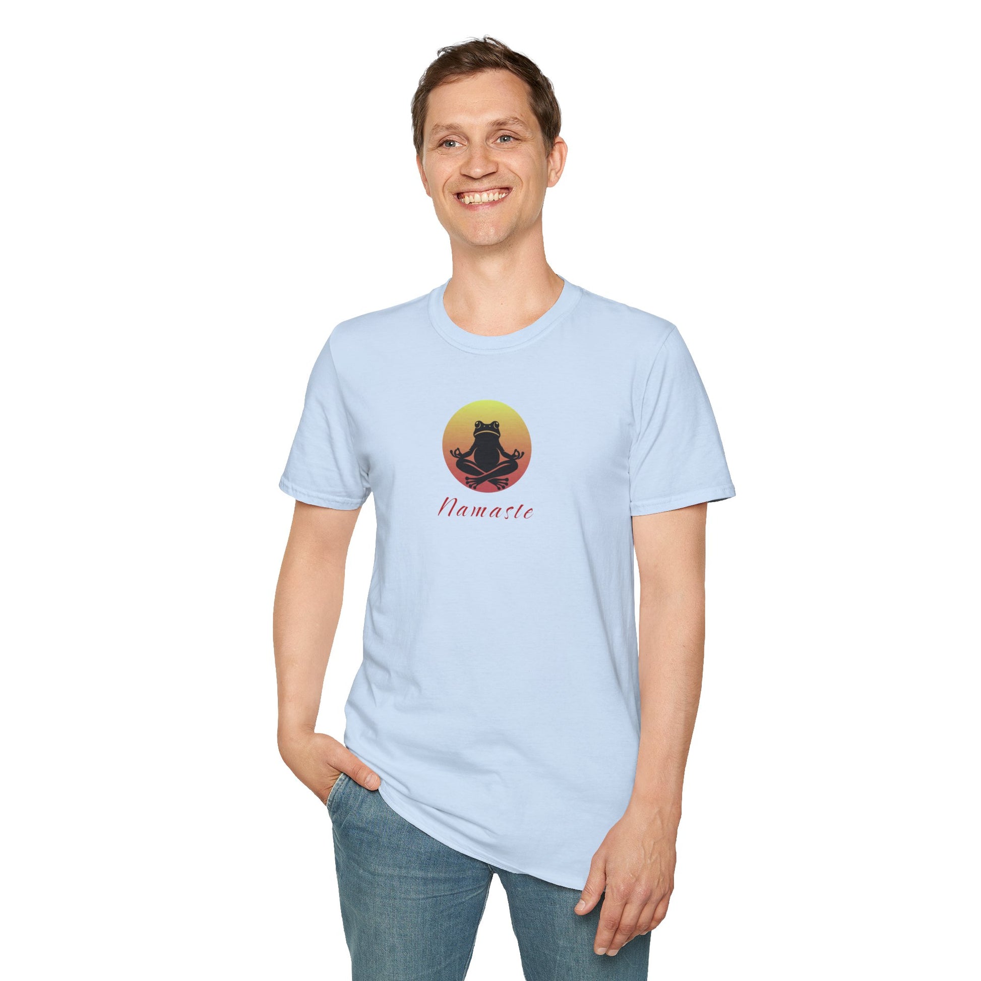 A man wearing a light blue colored T-shirt featuring a relaxed frog in a peaceful yoga pose, ideal for self-care enthusiasts and mindfulness lovers. This zen-inspired shirt offers comfort and calm for yoga practice or everyday wear
