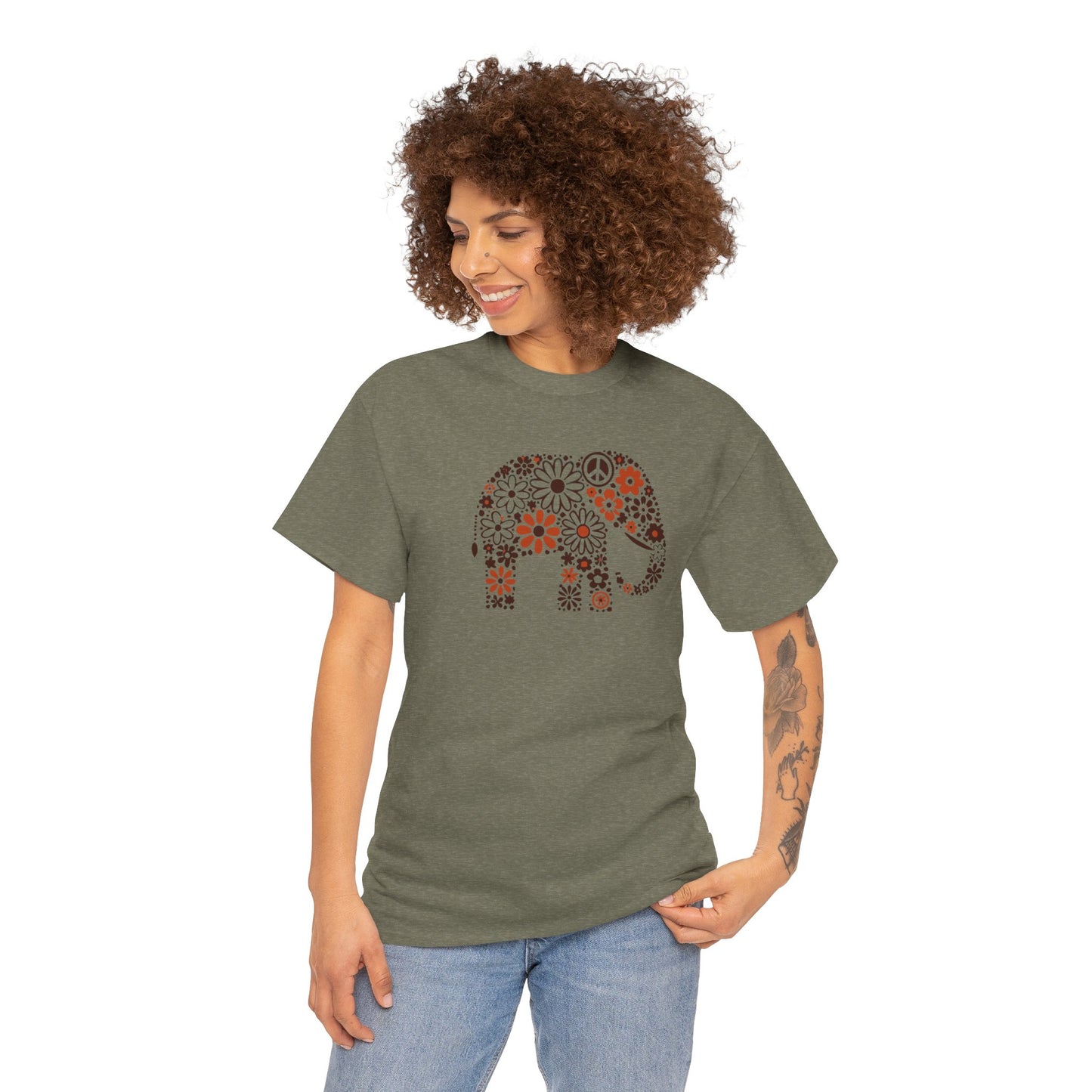 a woman wearing a  heather military green color t-shirt with an image of an elephant created out of brown and orange floral design